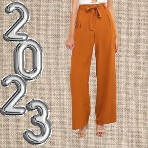 Wide leg Slack Pants . Light weight with tie belt .